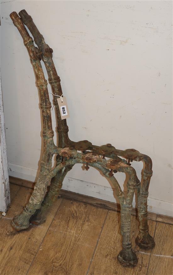 A pair of Victorian cast iron bench ends H.79cm